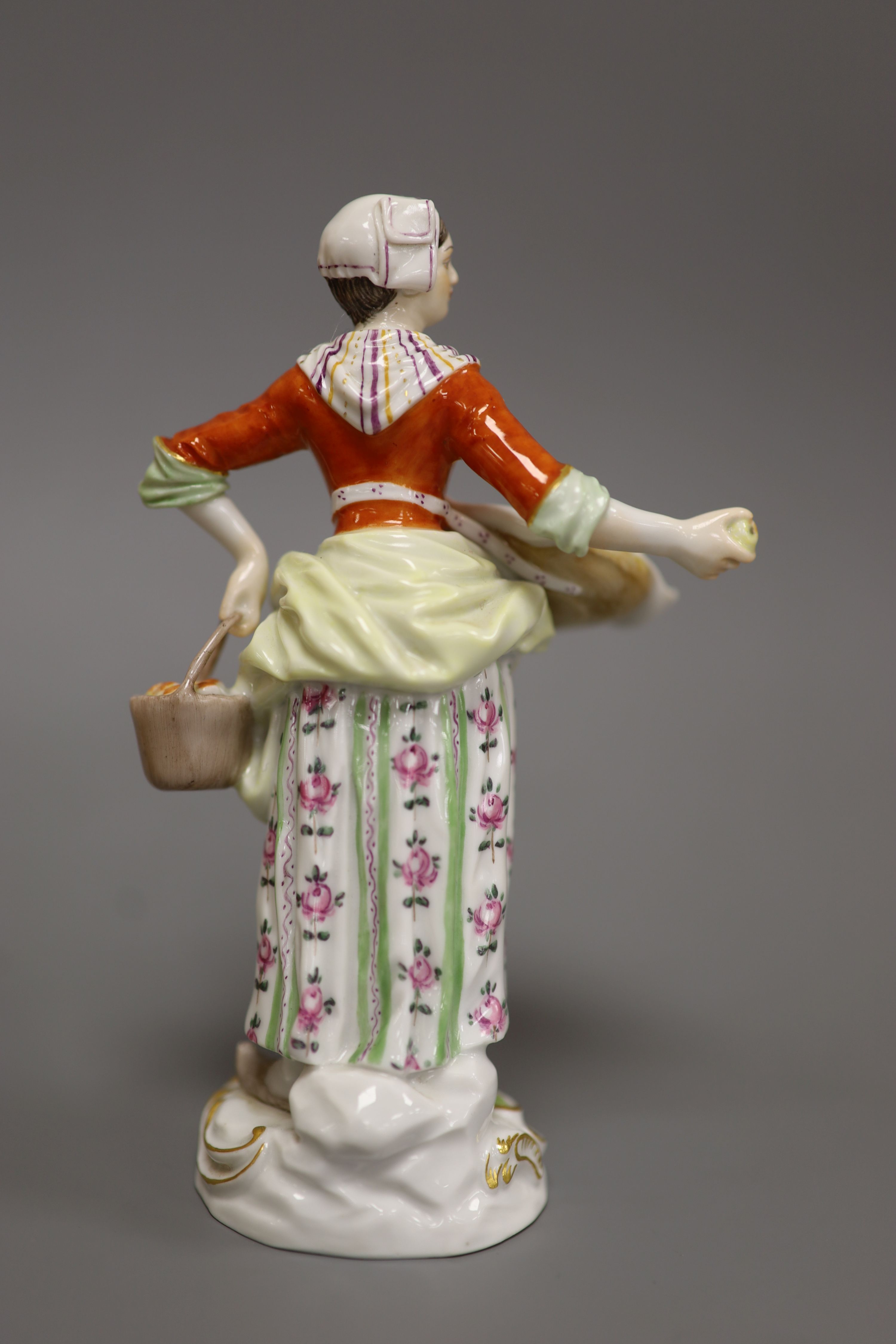 A late Meissen porcelain figure of a girl selling apples, H 14cm